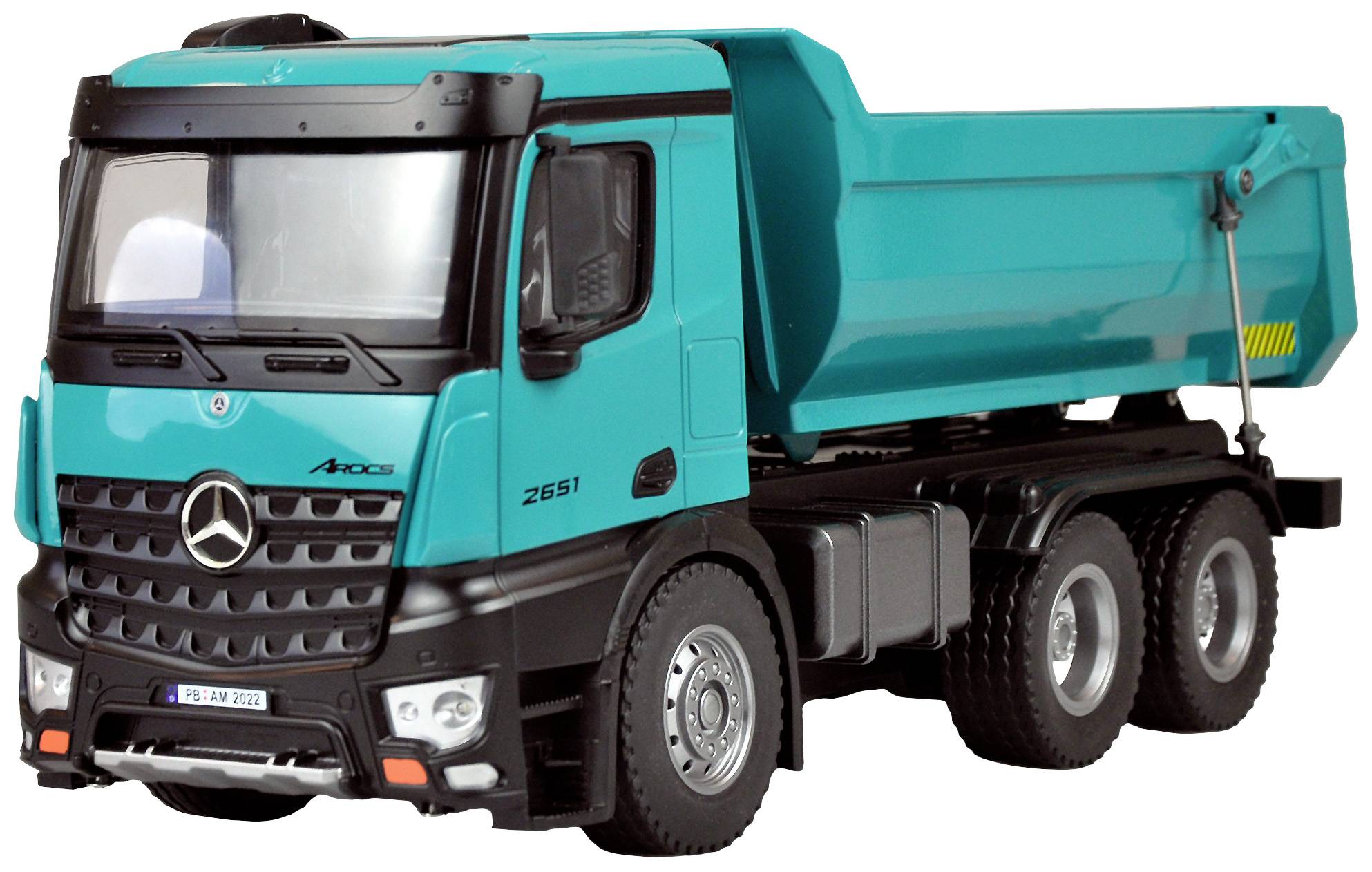 A turquoise tipper lorry parked on a road. The lorry is a Mercedes-Benz model.