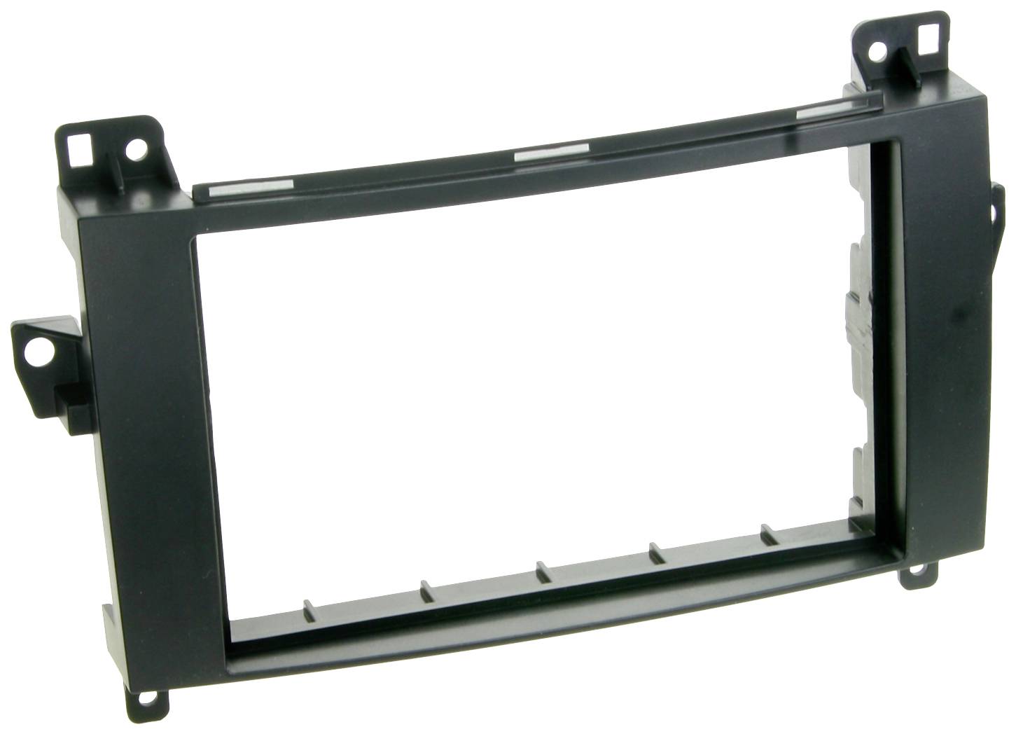 Rectangular black plastic mounting bracket with fixing points. Used for installing car radio devices in dashboards.