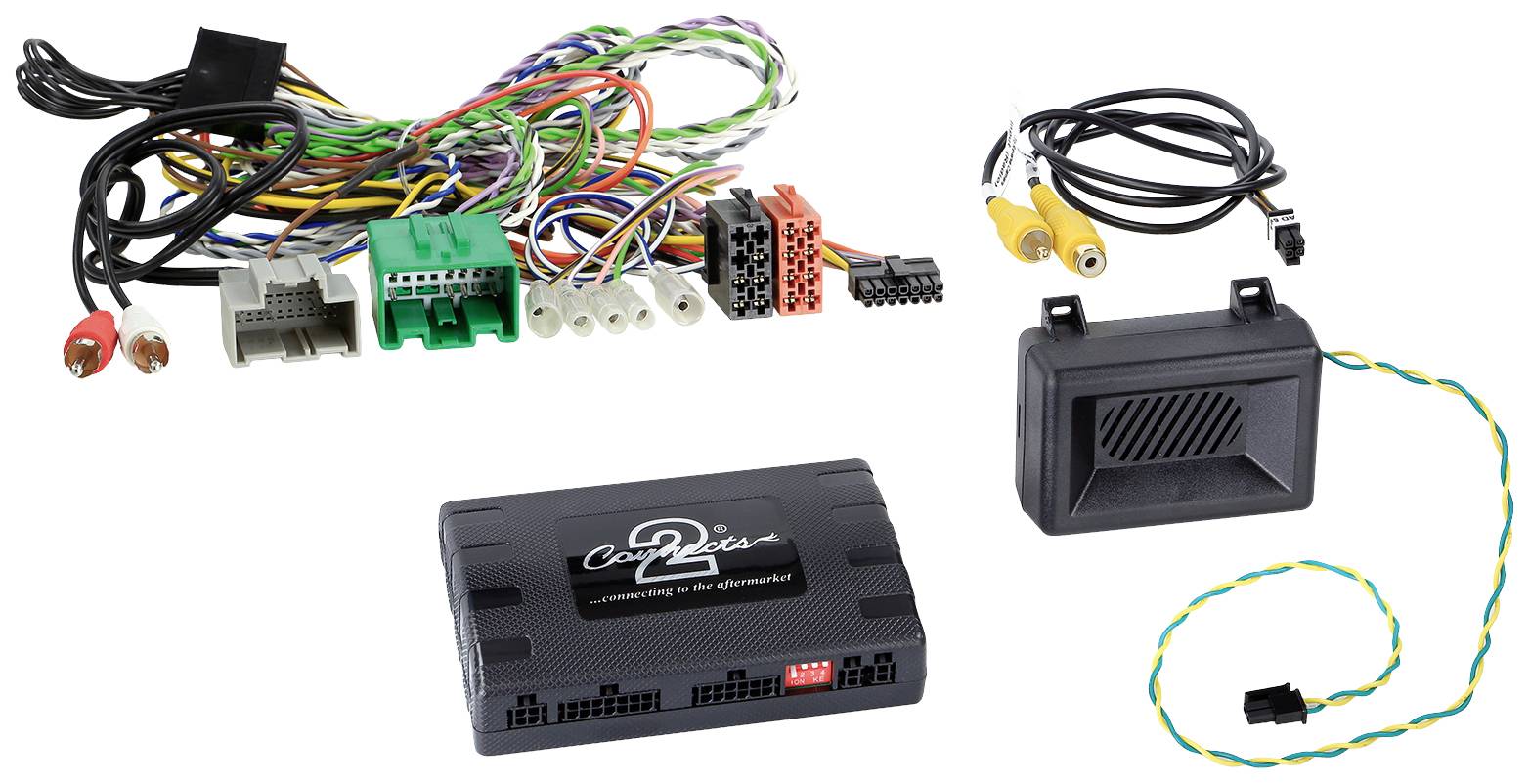 An electronics kit with cables and modules, consisting of several colourful connection cables, a control unit, and a small black enclosure.