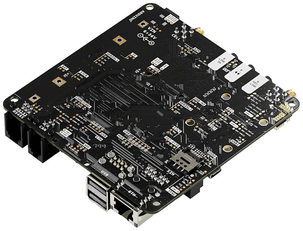 Black printed circuit board with electronic components and connections, including USB and LAN ports, for computer-assisted applications.