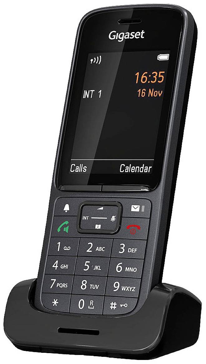 A black cordless telephone on a base station displays the time '16:35' and the date '16 Nov' on its screen.