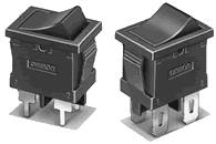 Two black toggle switches, each with two metal terminals, shown at slightly different angles.