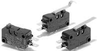 Three black microswitches with metal levers positioned at different angles. They have multiple connection pins.