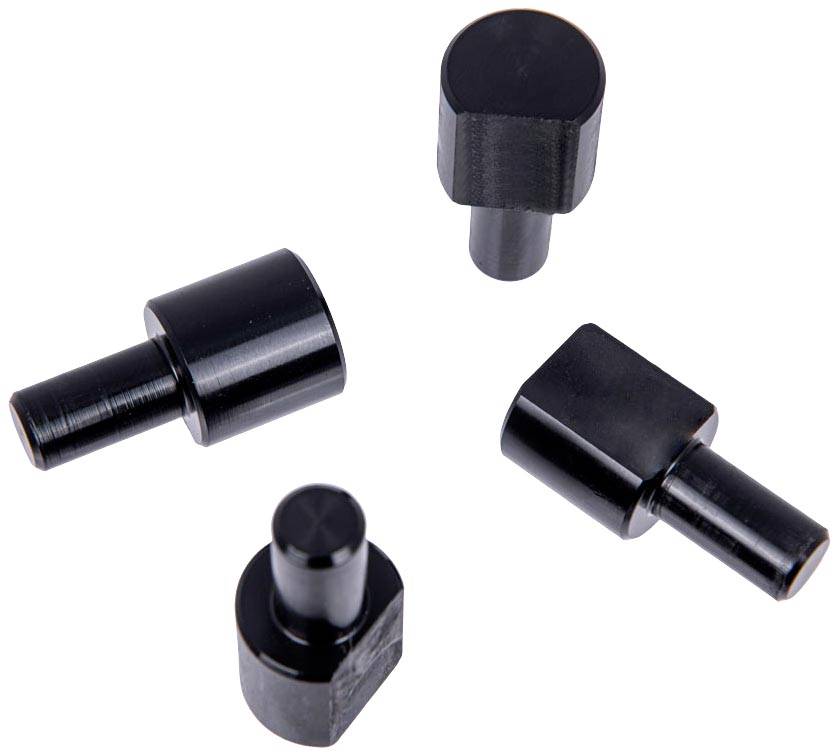 Four black metal components of different shapes and sizes, arranged on a white background.