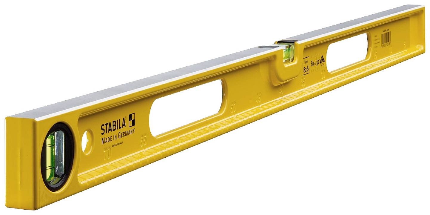 Spirit level made of yellow metal with two vials for measuring horizontal and vertical planes.