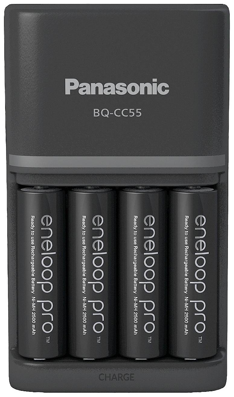 A Panasonic charger, model BQ-CC55, with four charged Eneloop Pro batteries, designed for AA rechargeable batteries.
