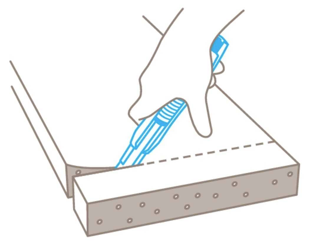 Diagram shows a hand cutting along a dotted line on a board with a craft knife.