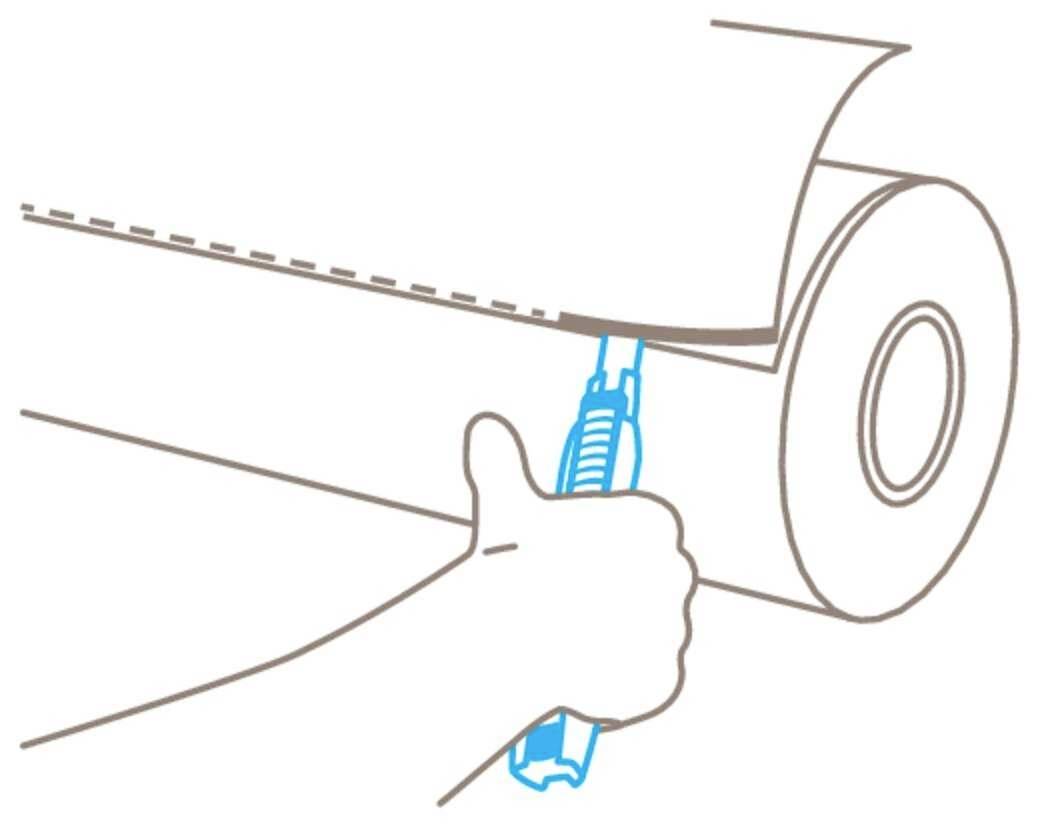 A hand is cutting a paper roll with a knife along a dotted line.
