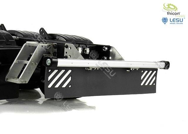 Tow bar for RC truck on white background. Robust metal construction with black mudguard and protective strips.