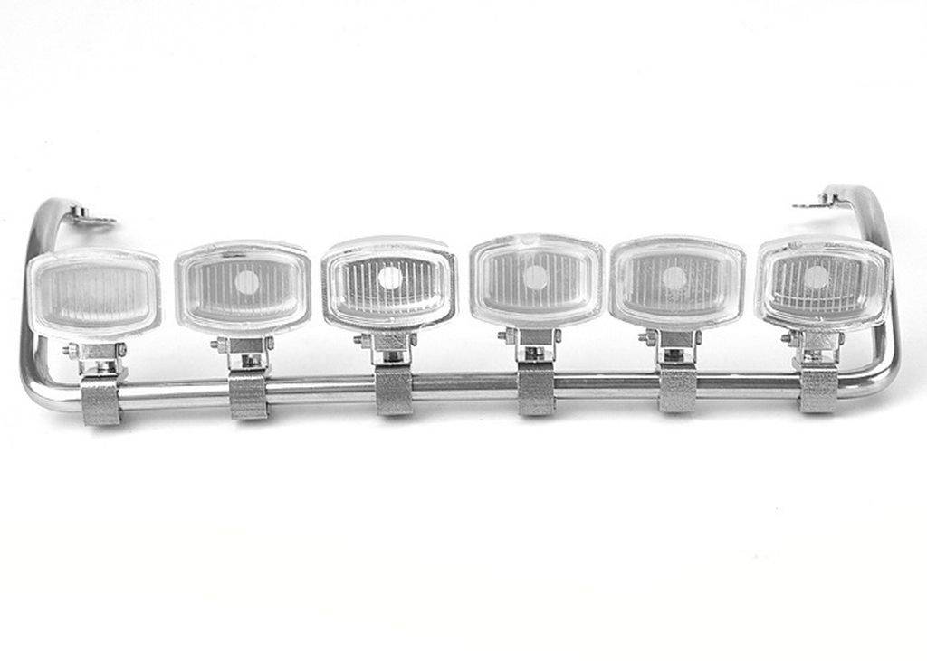 A set of six rectangular headlamps is mounted on a metallic bracket, all fitted with clear covers.