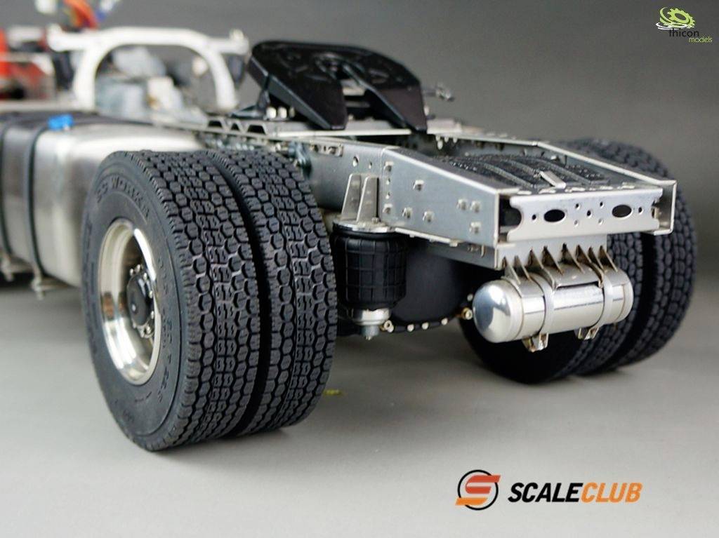 A model lorry chassis with a visible frame, tyres, and several mechanical components. 'SCALECLUB' brand logo positioned bottom right in the image.