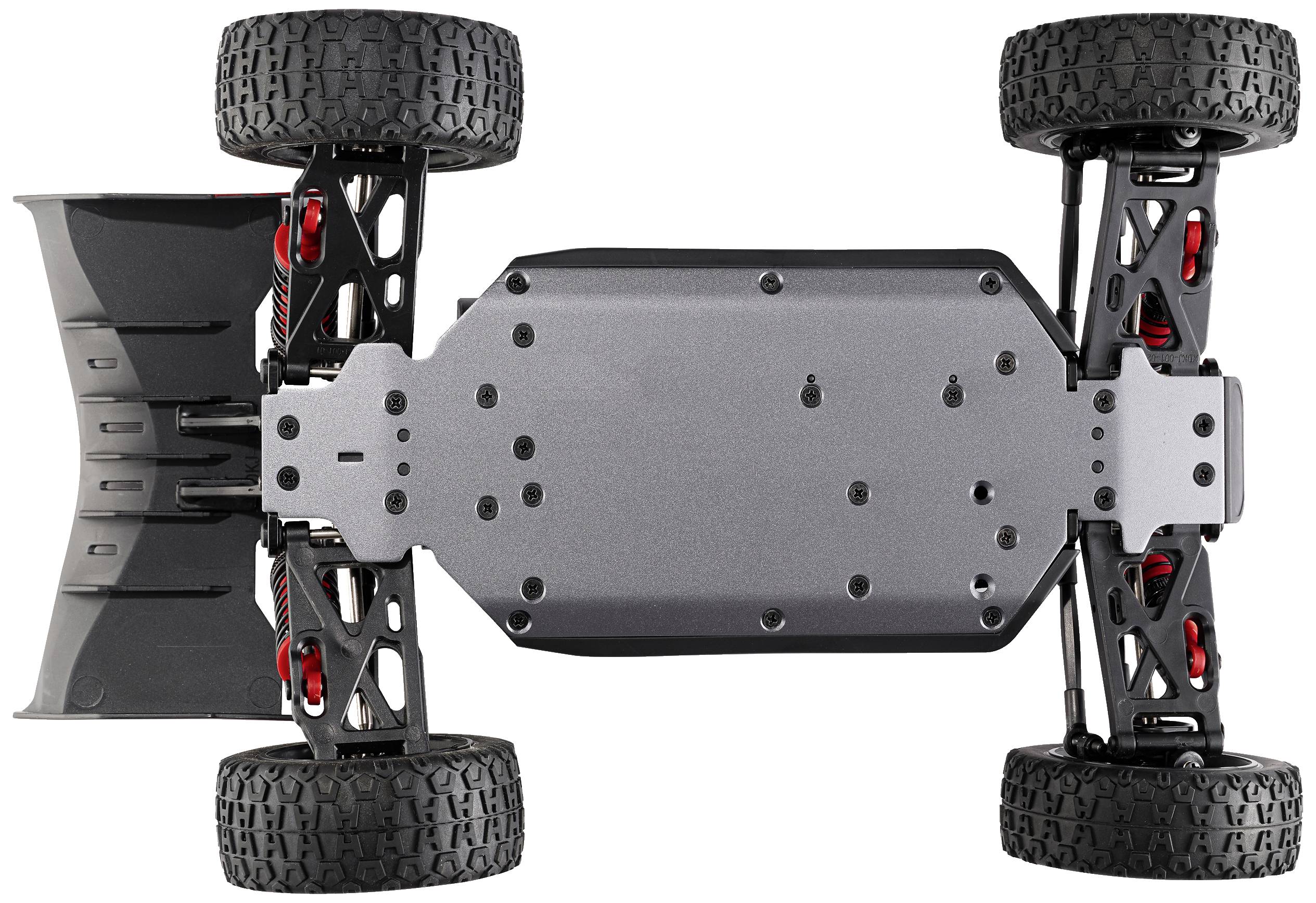 Underside of an RC car; black chassis plate, robust off-road tyres, visible shock absorbers and wishbones.