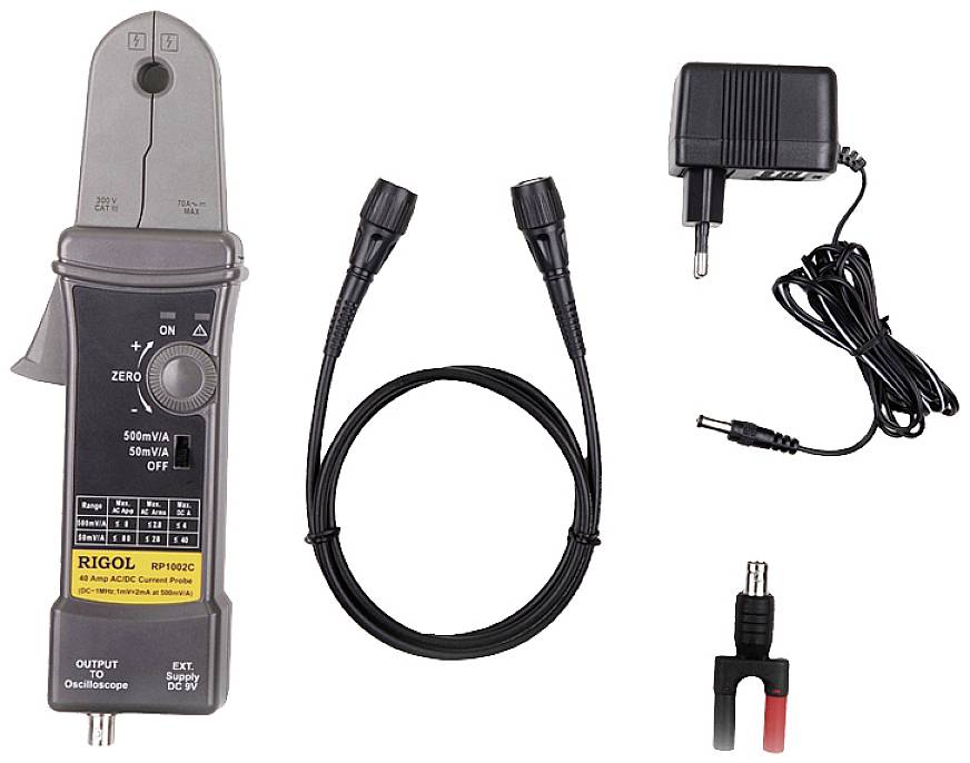A current measuring device with a clamp, cables, a mains adapter, and a small accessory part. Ideal for measuring and analysing current strengths.