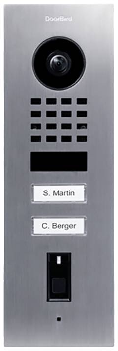 Door entry system with camera and speaker, with two nameplates reading 'S. Martin' and 'C. Berger' underneath. Below that, a doorbell button.