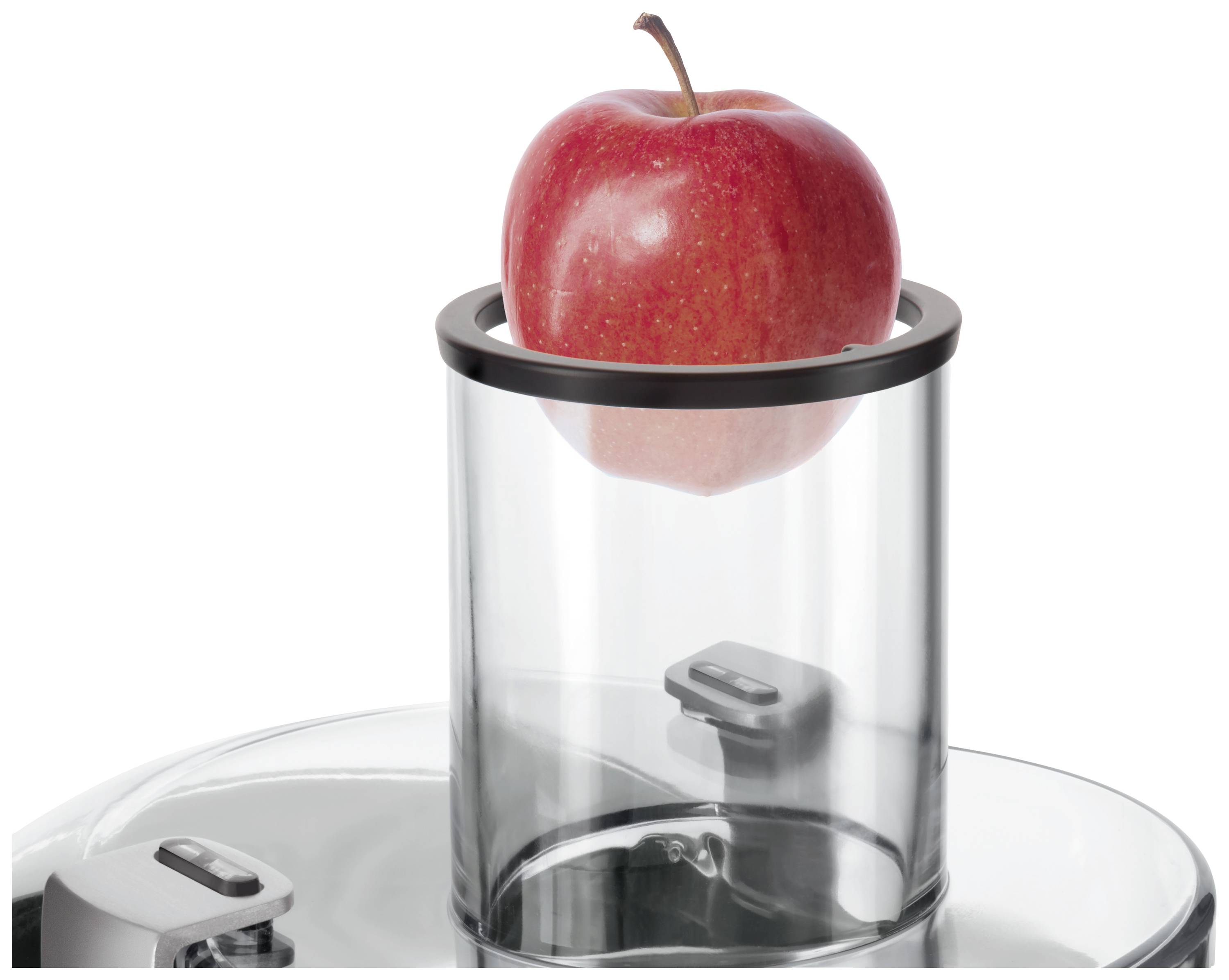 A red apple sits in a glass cylinder, ready for a juicer. The apple is fresh and vibrant.