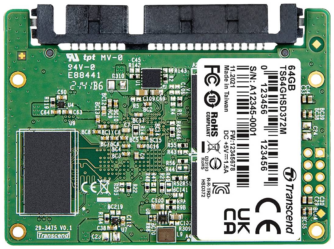 Solid-state drive circuit board, 64 GB with Transcend logo, electronic circuits, connector at the top and label with serial number and certifications.