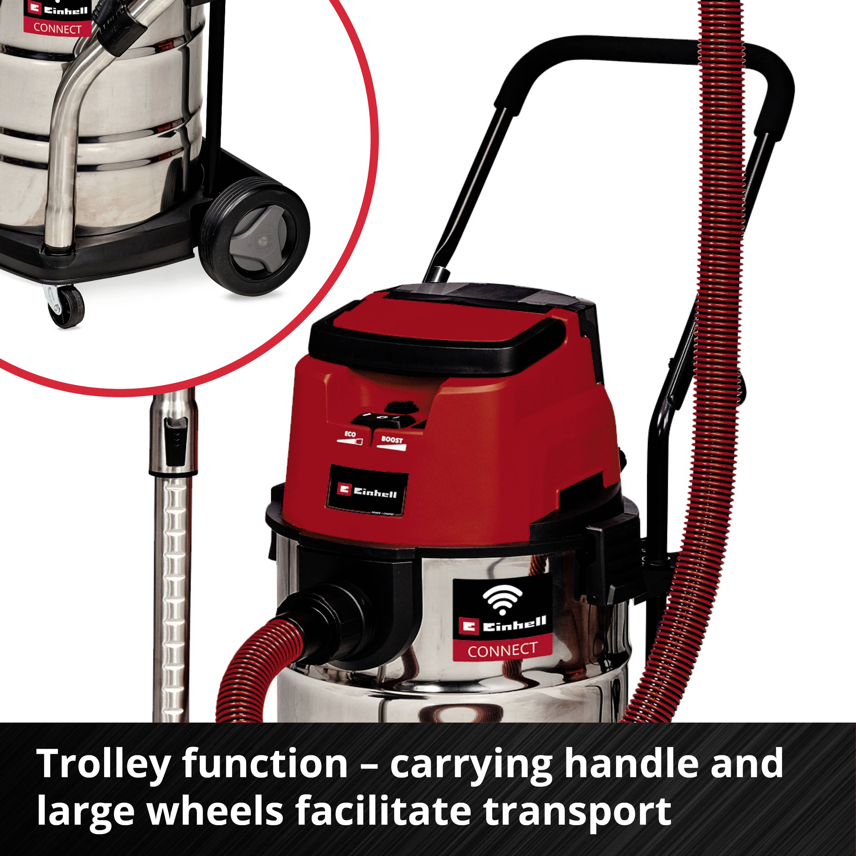 Einhell vacuum cleaner with large wheels and carry handle for easy movement. Text: Trolley function – carry handle and large wheels make transportation easier.