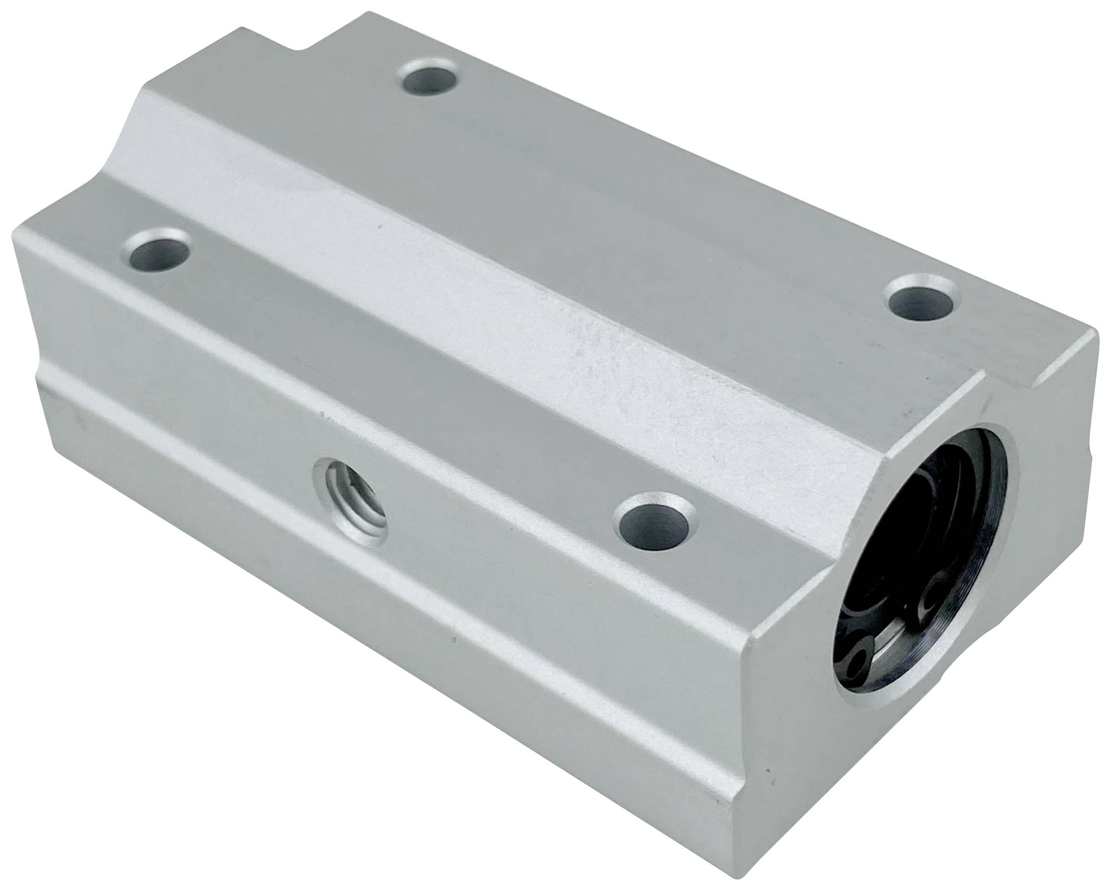 Rectangular metal block with round openings at the corners and a central hole on the front face.