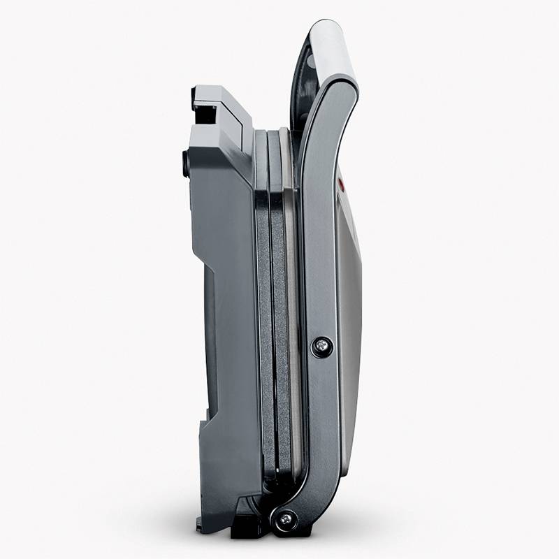 A closed contact grill viewed from the side, showing its compact, vertical storage for space-saving purposes.