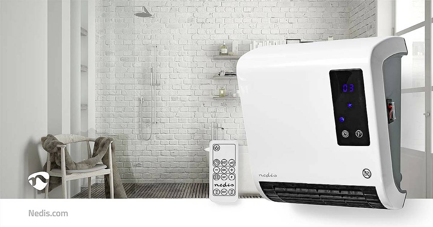 A white wall-mounted heater and remote control in the bathroom. In the background, a white brick wall with a shower.