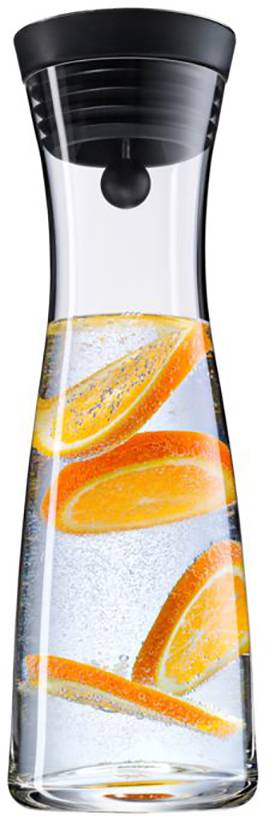 A slender glass carafe with a black lid, filled with water and orange slices.