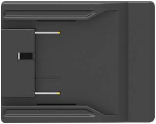 Top-down view of a dark gray rectangular electronic device or dock with a central slot and two exposed connector pins on the left side.