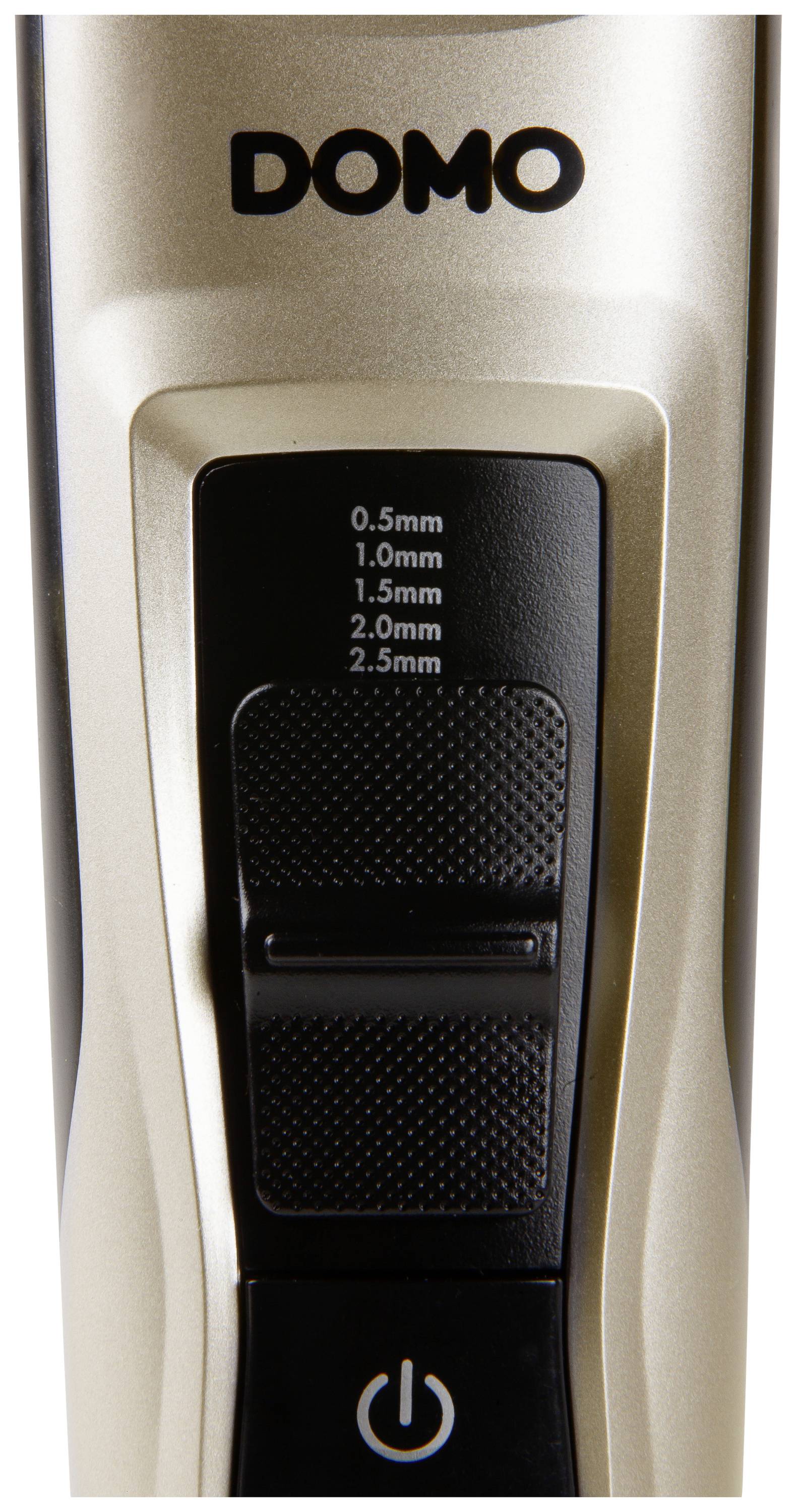 A Domo electric hair clipper with length settings from 0.5 to 2.5 mm and an on/off switch beneath it.