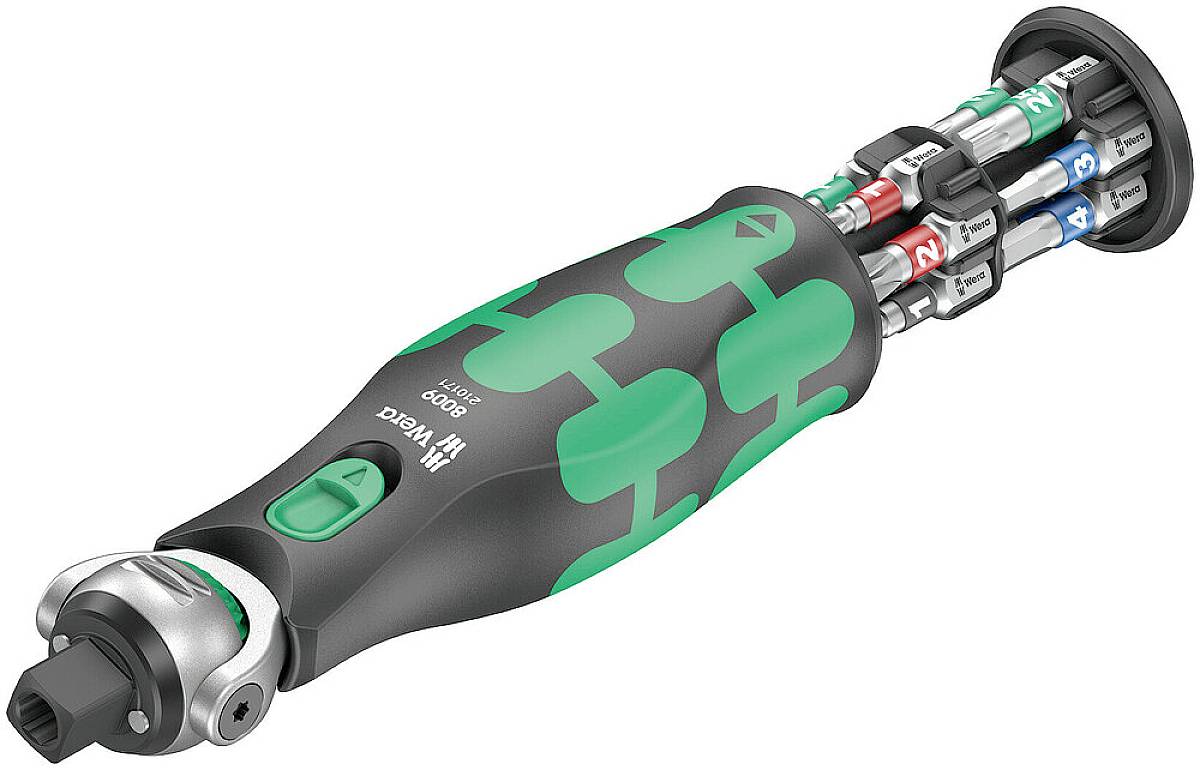 A green and black screwdriver with various bits in the handle, for versatile applications in craftsmanship.
