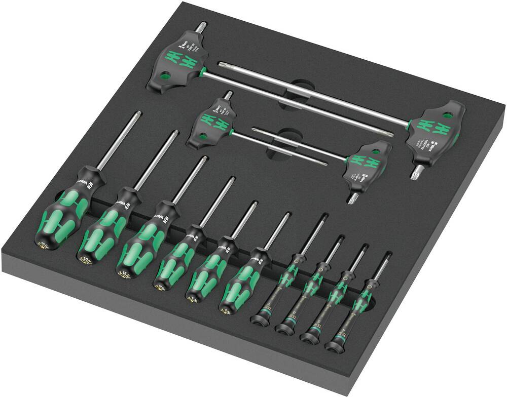 A set of screwdrivers and T-keys in a foam insert. They are made of metal and plastic with green handles.