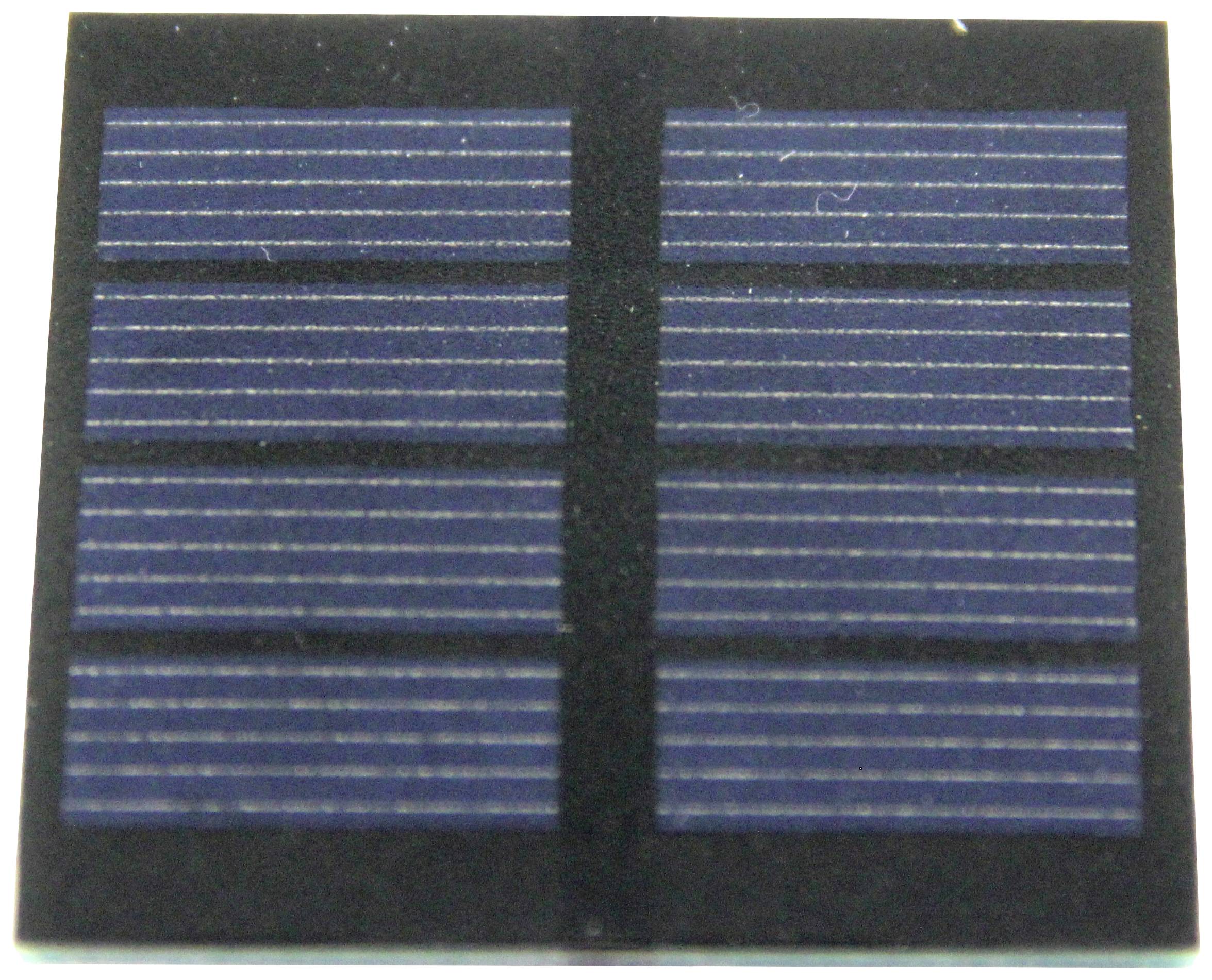 A close-up of a blue solar cell with eight rectangular segments arranged in parallel, featuring fine white lines.