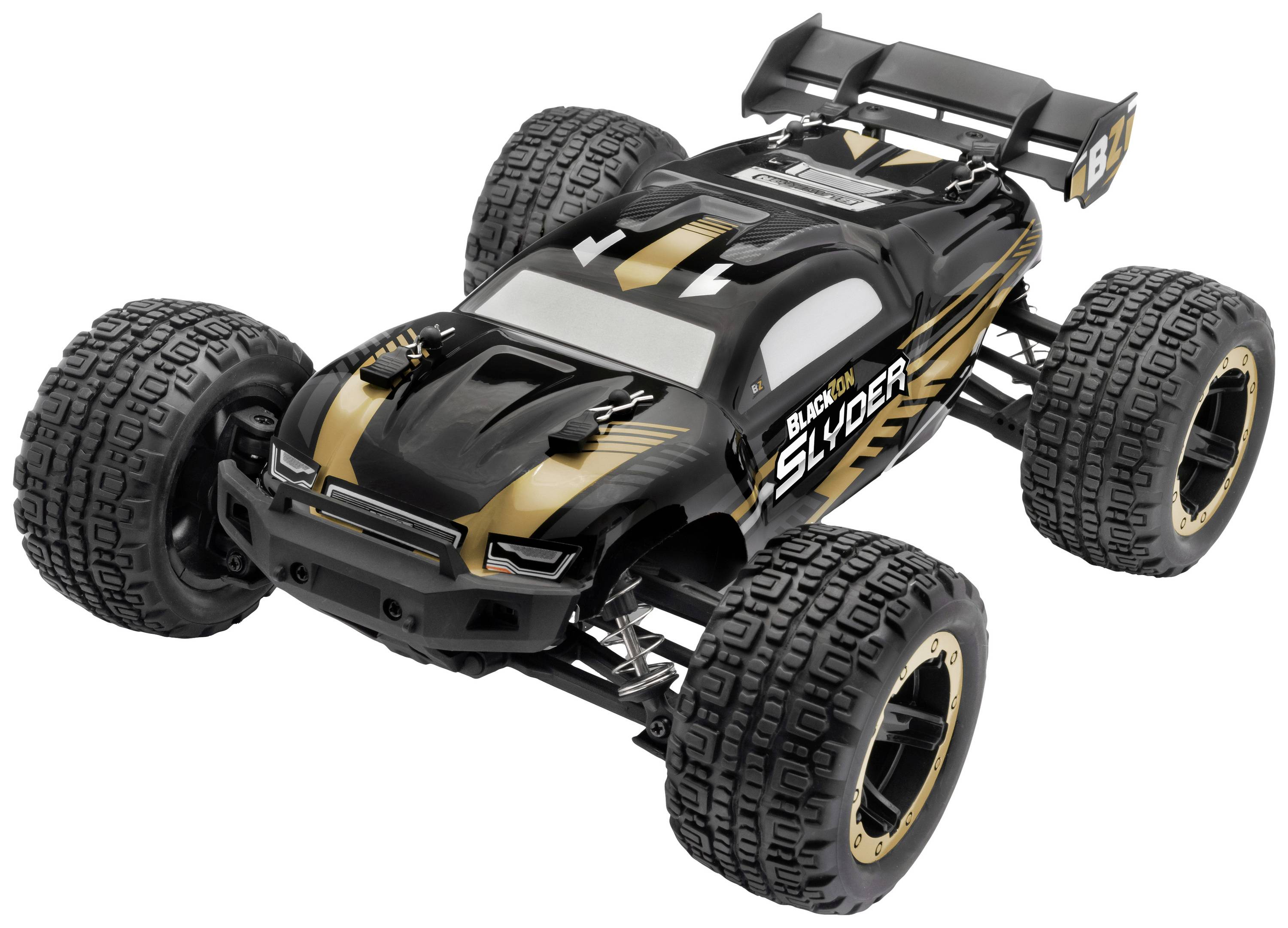 A remote-controlled car in black with golden accents. Large, robust tyres and a sporty rear spoiler.