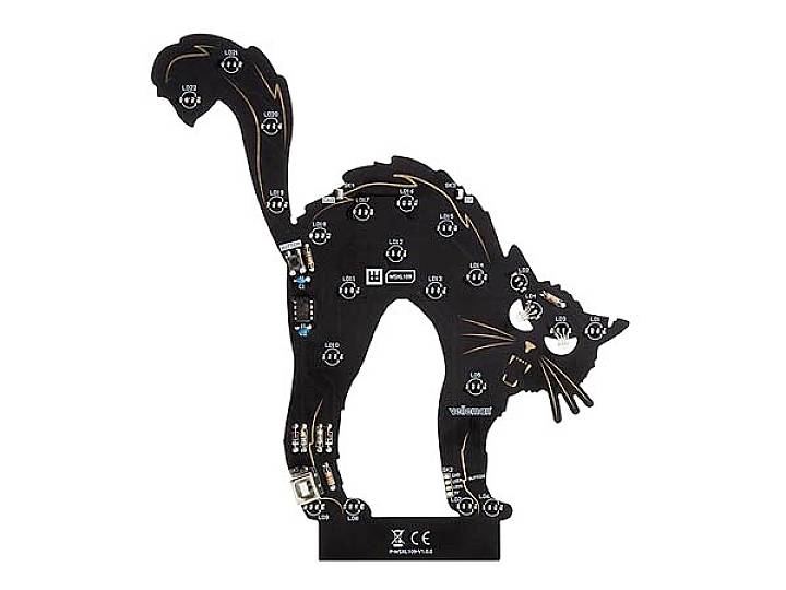 Electronic kit in the form of an elongated cat with various electronic components and connections on the circuit board.