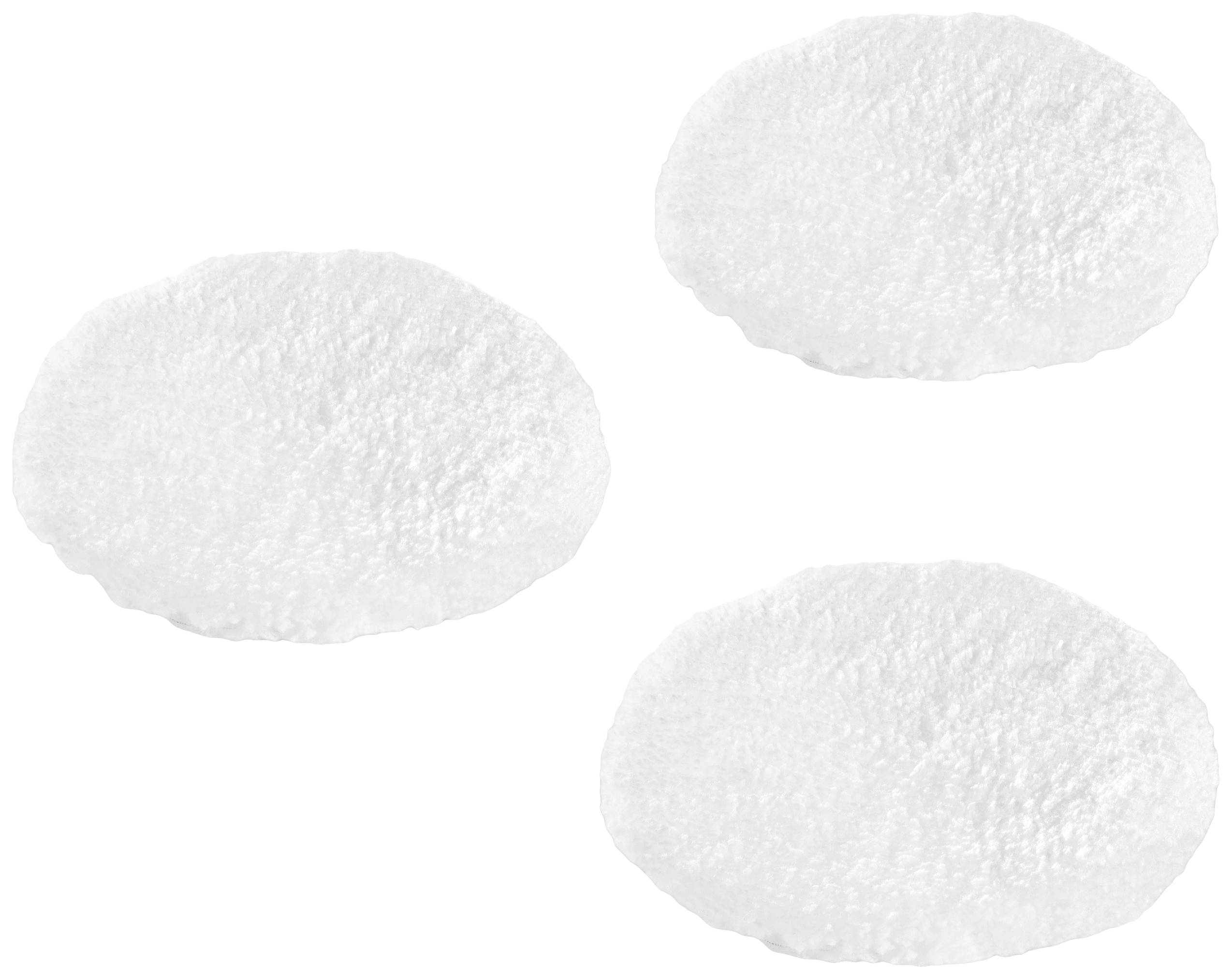 Three white, round cotton pads scattered slightly on a white background.