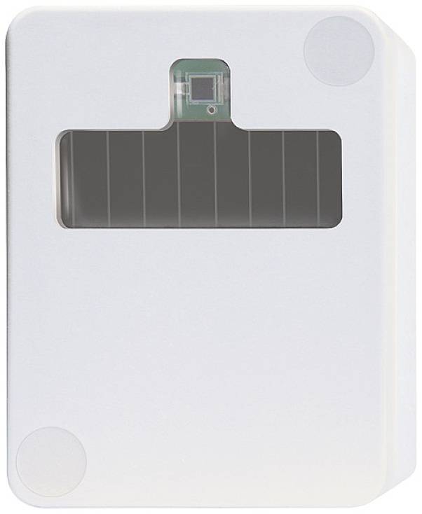A rectangular, white device with a dark rectangular window in the centre, possibly a sensor or electronic device.