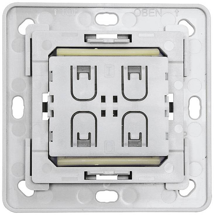 Close-up of a switch module in a wall socket, ready for installation. 'TOP' and 'OPEN' markings are visible at the top.