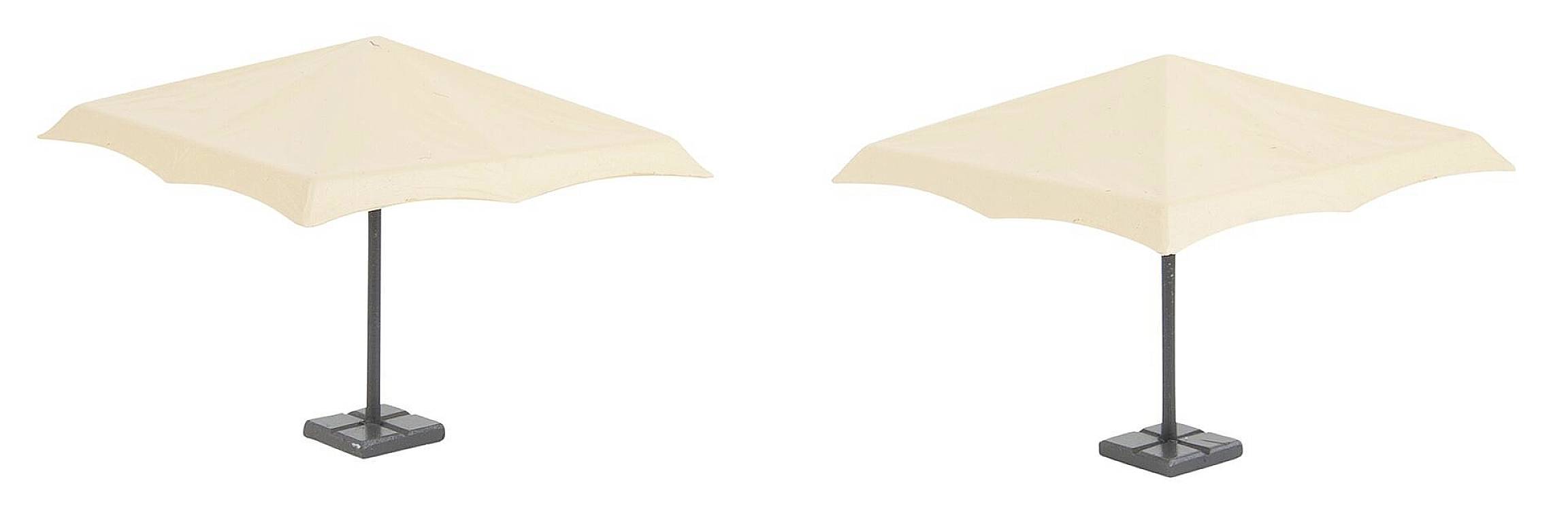 Two beige parasols with a square design, each with a black base.