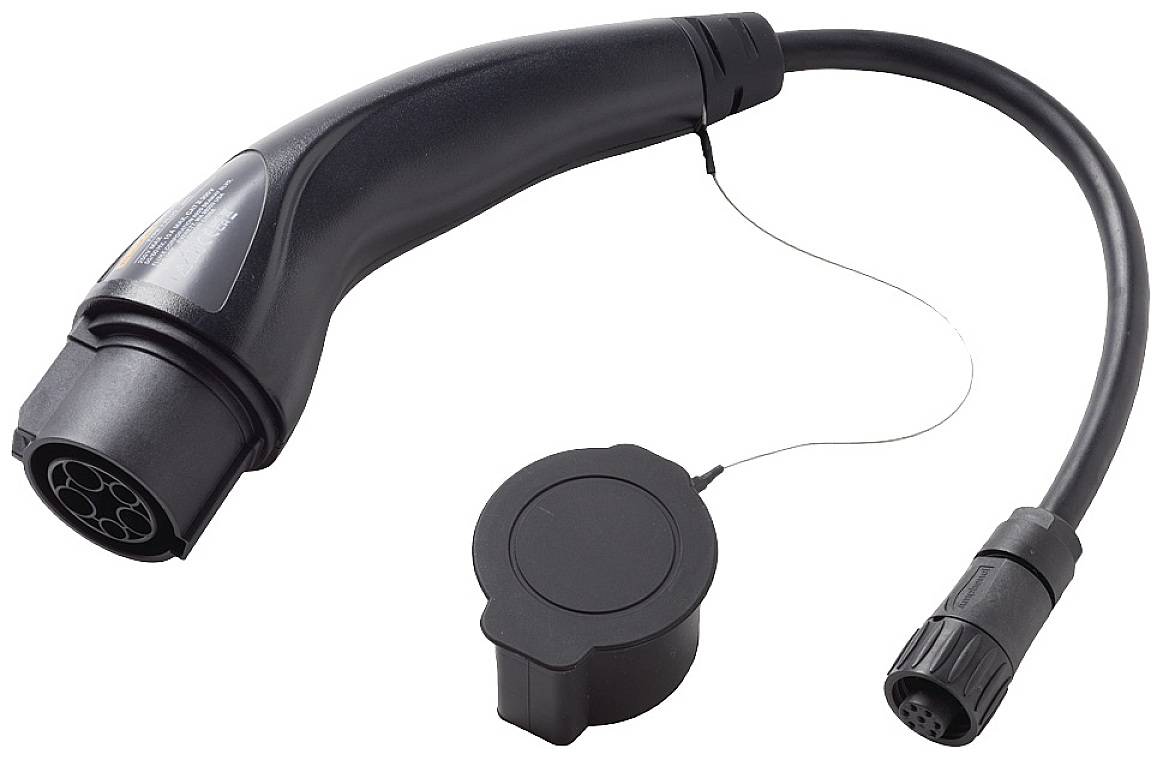 Black plug of an electric car charging cable with a protective cap, typical Type 2 connector for charging electric vehicles.