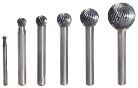 Six metal milling cutters in different sizes, arranged from small to large. The cutters have spherical heads with a grooved pattern.