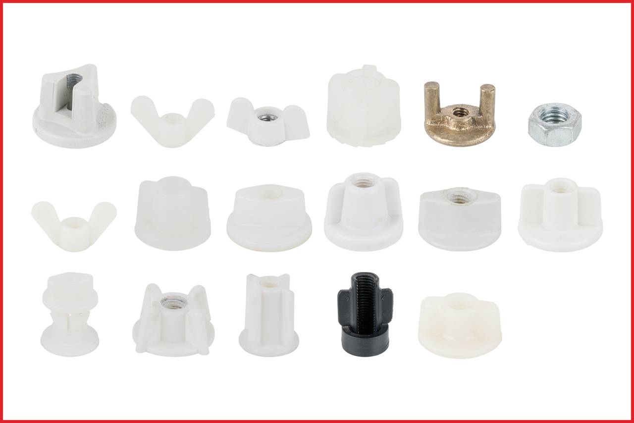 Various types of nuts and fastening elements in white and metallic colours, distributed across a white background.