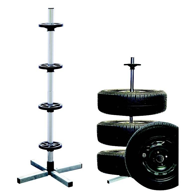 A tyre rack; on the left with rims without tyres, on the right with four stacked car tyres on the stand.