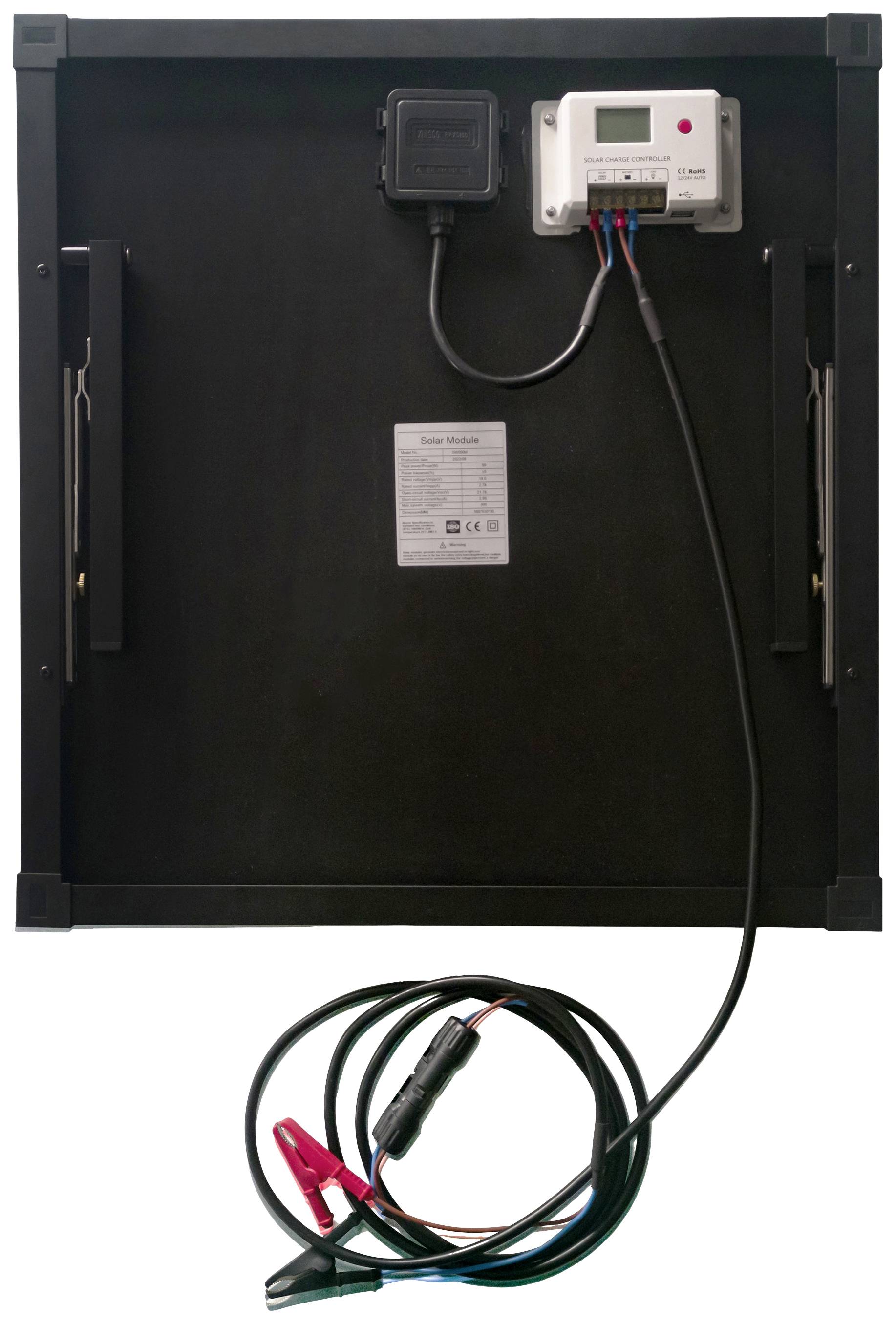 Back of a solar panel with an attached charge controller and cable with crocodile clips, ready for power transmission.
