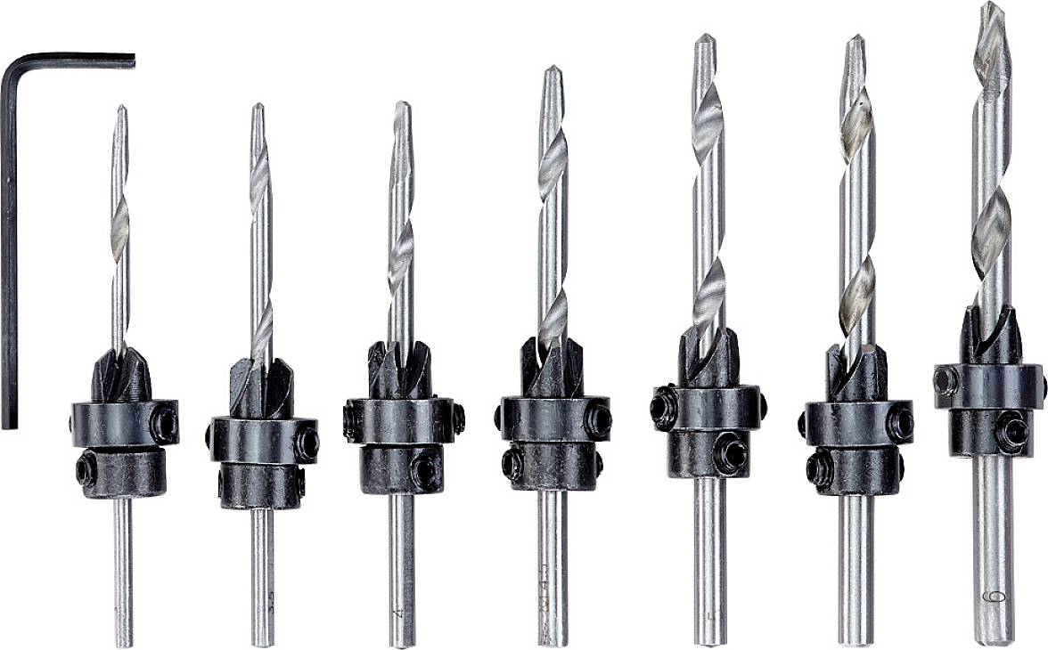 Seven-piece metal drill bit set with varying diameters and a hexagonal allen key, designed for use with power drills.