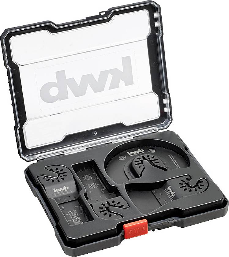 Tool set in a plastic box, containing various saw blades and accessories for craft work.