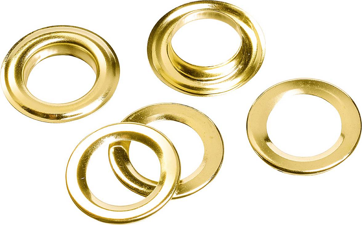 Five gold-coloured metal eyelets are lying on a white surface. They have a circular shape and are arranged in different positions.