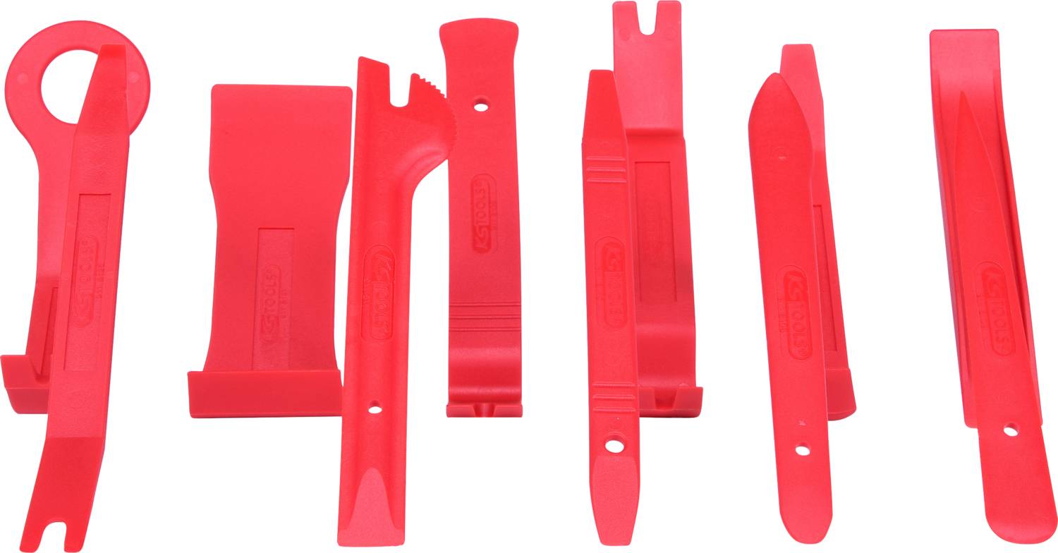 Red plastic tools in various shapes for car repairs or installations, lined up side by side.