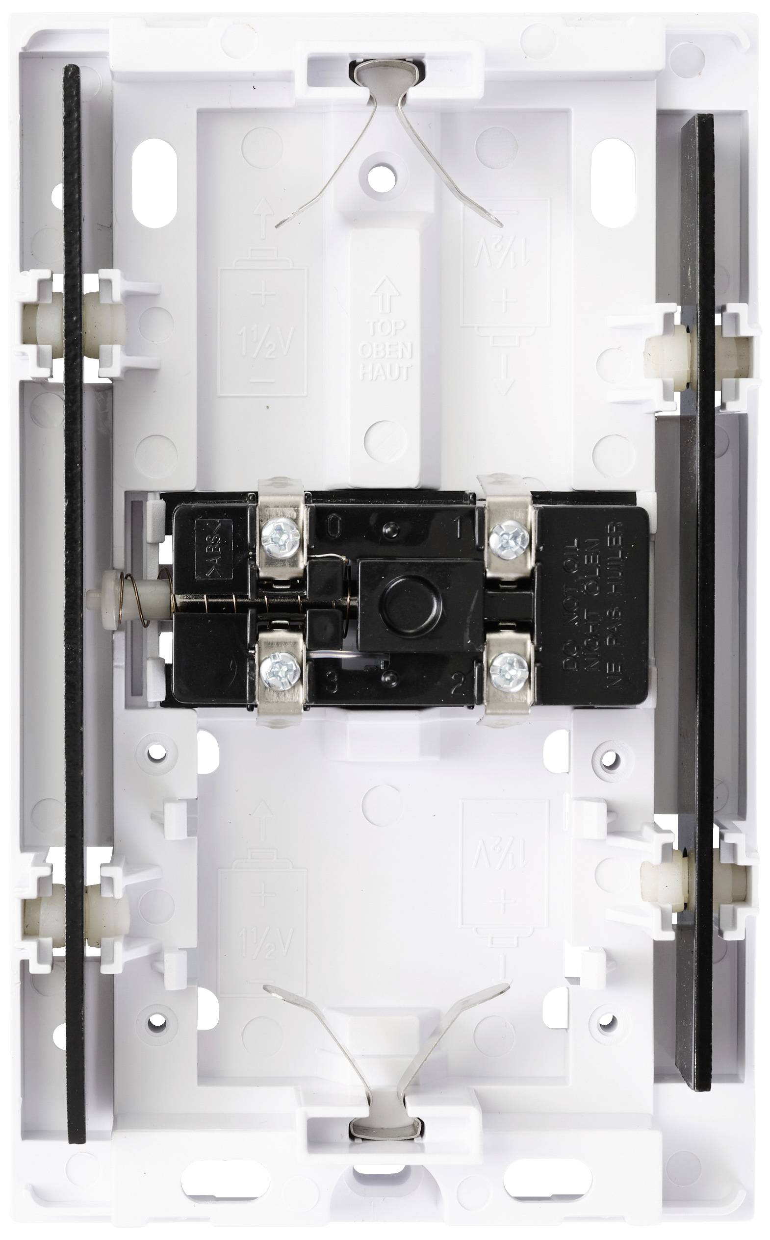 An open electrical consumer unit with visible connections and mounting brackets.