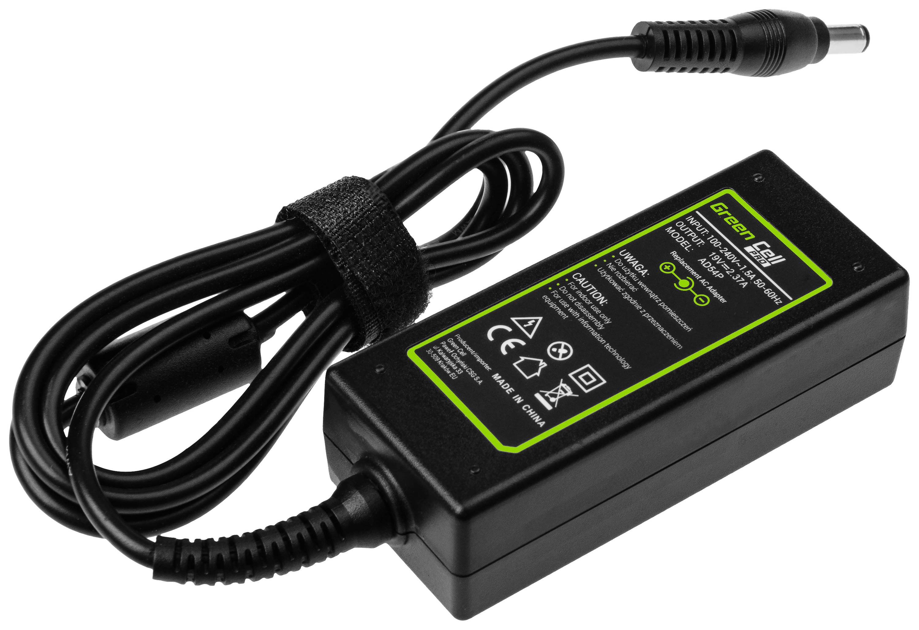 Black laptop power adaptor with cable, green printing with specifications and safety symbols on the top surface.