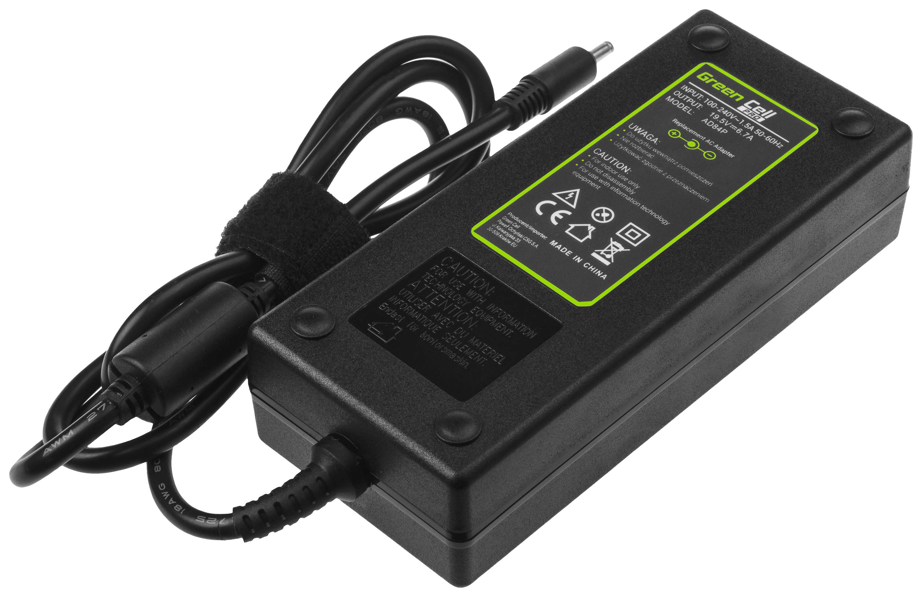 Black laptop power adapter with cable and green sticker displaying technical specifications and safety symbols.
