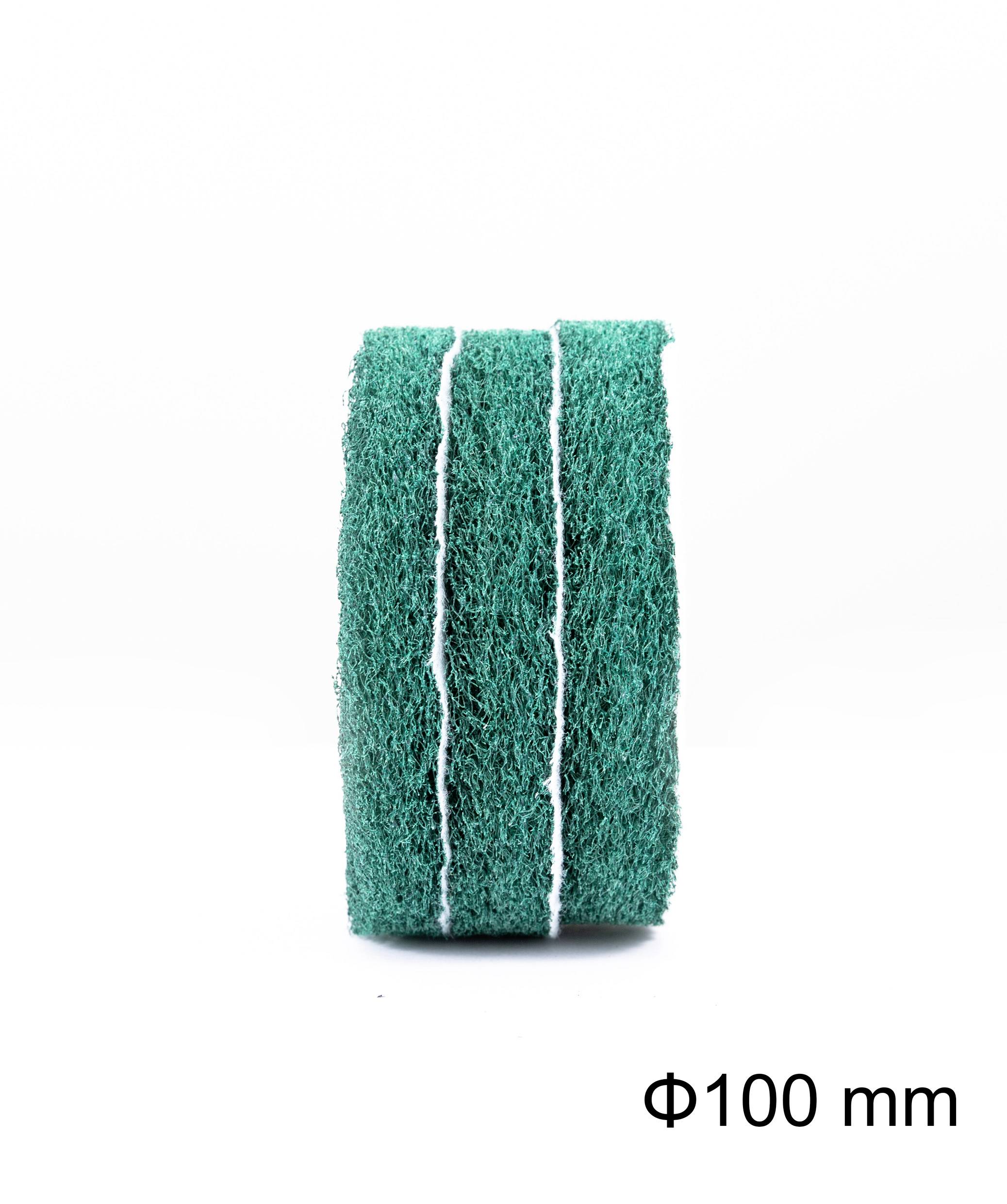 A green kitchen sponge, shown standing, with three white stripes, 100 mm in diameter. Ideal for cleaning purposes.