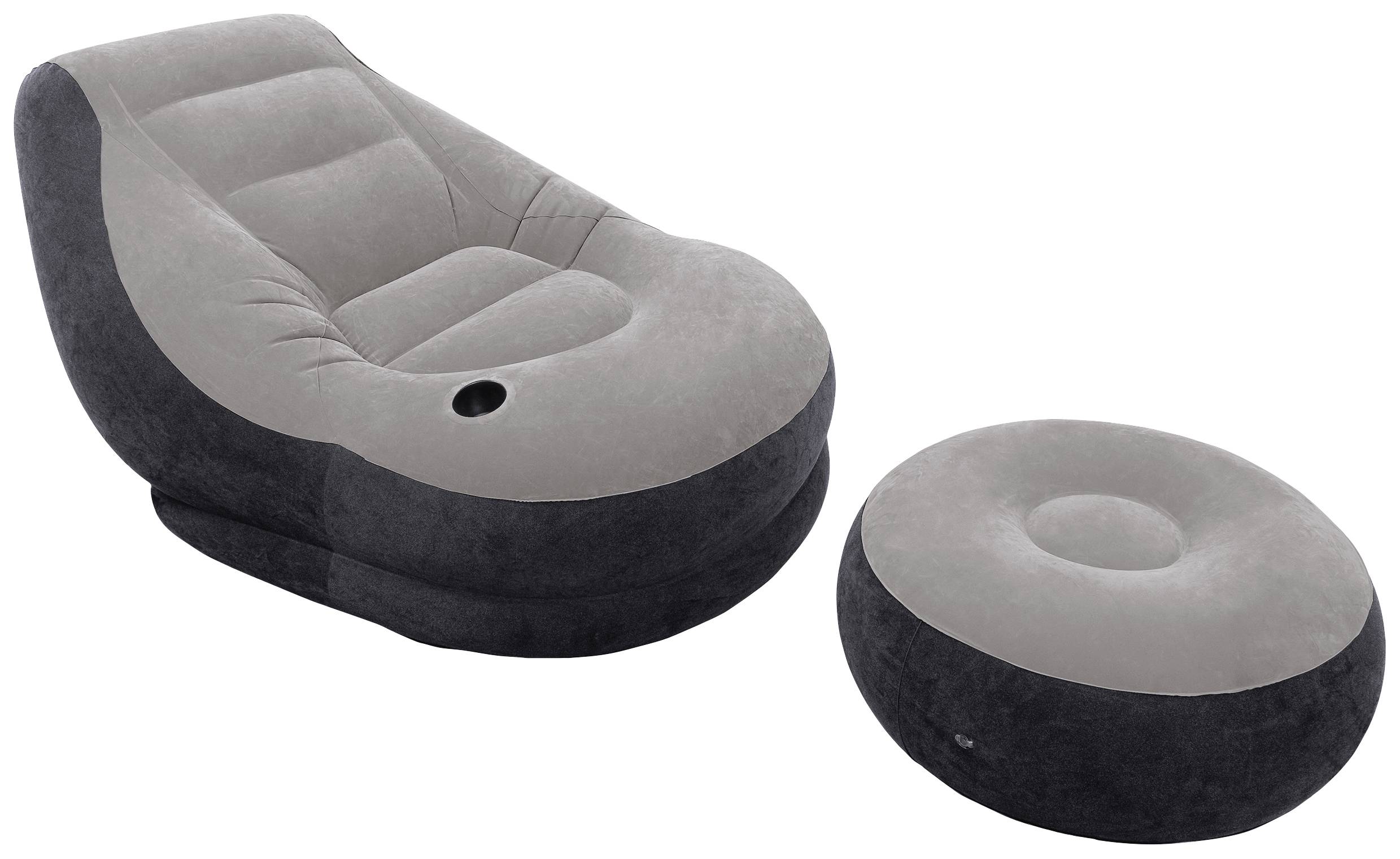 Grey, inflatable armchair with a round footrest, perfect for relaxed seating in indoor spaces.
